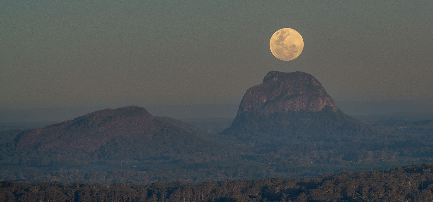 Moon rising over Mount Tibrogargan