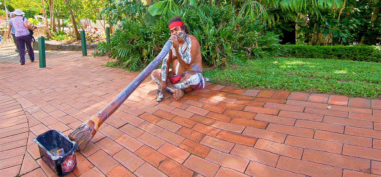 Aboriginal playing the didgeridoo