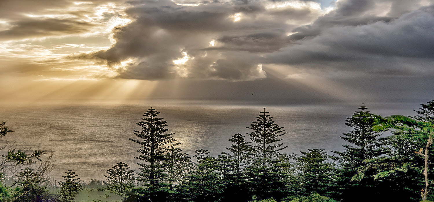 Sunrise through the clouds from Mount Bates 