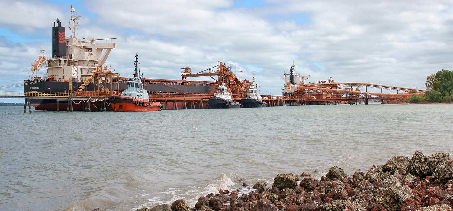 Boats being loaded with bauxite